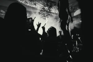A lively crowd enjoying a DJ performance at a popular Ayia Napa music venue